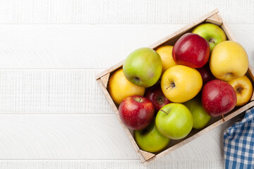 Colorful ripe apple fruits in box
