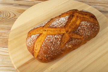 Freshly Baked Traditional Bread on Wooden Background