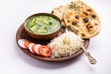 palak baby corn sabzi also known as spinach makai curry served with rice or roti, Indian food