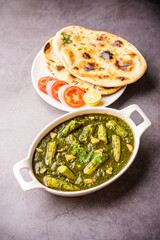 palak baby corn sabzi also known as spinach makai curry served with rice or roti, Indian food