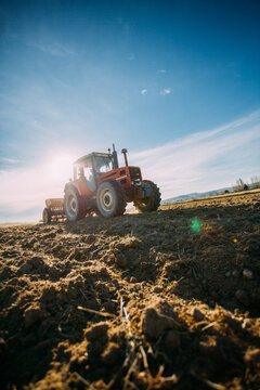 Old tractor working on the field