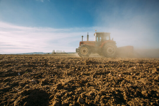 Old tractor working on the field