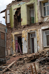 Fototapeta na wymiar Destroyed residential building. Abandoned apartment building.