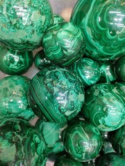 Fototapeta na wymiar round balls of green semi-precious stones