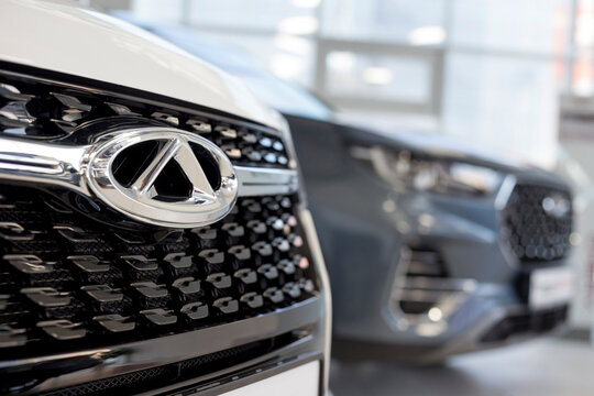 Russia, Izhevsk - August 19, 2021: Chery showroom. New modern cars in dealer showroom. Car manufacturer from China.