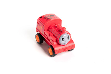 Colorful plastic train, isolated on white background.