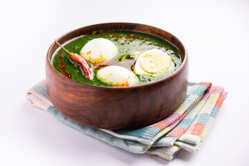 Spinach egg curry is an Indian non vegetarian dish made using palak gravy with eggs