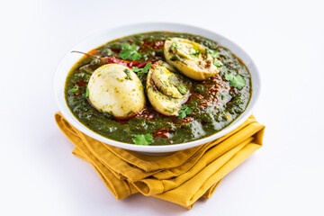 Spinach egg curry is an Indian non vegetarian dish made using palak gravy with eggs