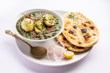Spinach egg curry is an Indian non vegetarian dish made using palak gravy with eggs