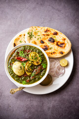 Spinach egg curry is an Indian non vegetarian dish made using palak gravy with eggs