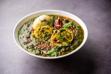 Spinach egg curry is an Indian non vegetarian dish made using palak gravy with eggs