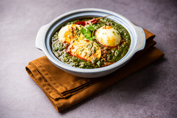 Spinach egg curry is an Indian non vegetarian dish made using palak gravy with eggs