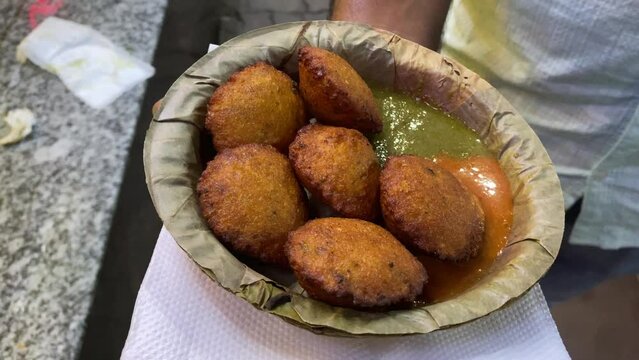 The delicious snack known as Moong Dal Pakoda, often referred to as Moong Dal Bhajiya or Moong Dal Vada, is frequently sold on the streets of Kolkata, West Bengal.