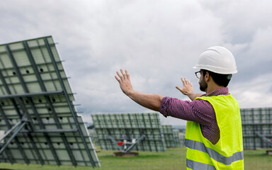 Male engineer planning photovoltaic panel construction