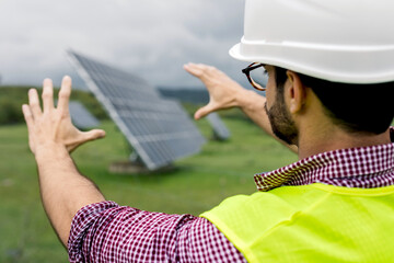 Male engineer planning photovoltaic panel construction