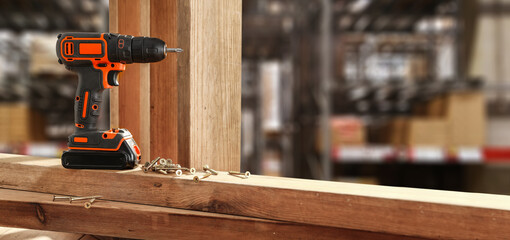 Drill on desk and workshop interior. 