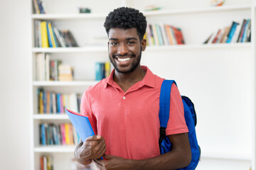 Portrait of afro american male student with backpack