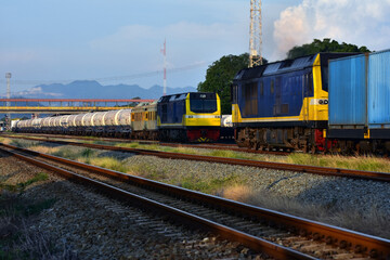 Fototapeta na wymiar Freight trains by diesel locomotive on the railway yard in Thailand
