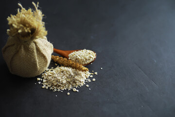 World grain crisis. A handful of cereals and on a dark background.