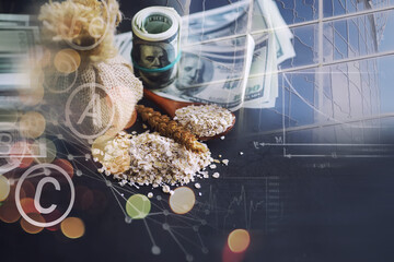 World grain crisis. Double exposure. A handful of cereals and 100 dollar banknotes on a blue background.