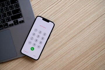 Tablet, laptop, desk.
