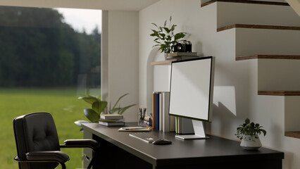 Modern minimal white home working space against the stairway with computer screen mockup