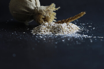 World grain crisis. A handful of cereals and on a dark background.