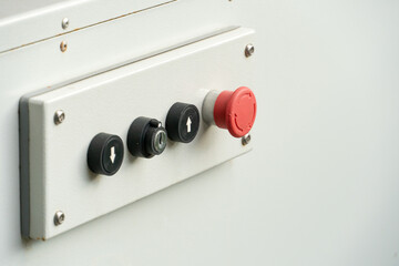 A mechanical device with a remote control and large buttons. Electrical selector switch, button switch, electrical switch gear.