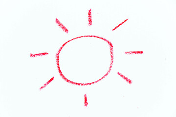 Red color oil pastel hand drawing in sun with ray shape on white paper background