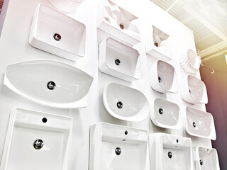Ceramic sinks with faucets for bathrooms in store