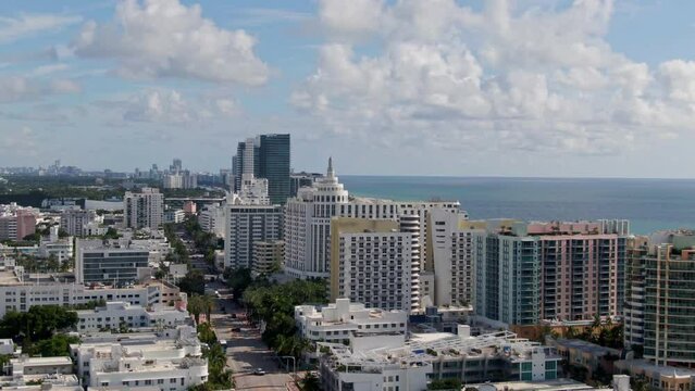 Miami city buildings and streets in birds eye view on sunny hot day
