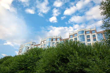 Obraz na płótnie Canvas multi-storey residential building on the background of the sky with clouds. Modern high-rise residential building.
