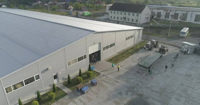 Morning at the factory. The beginning of the working day at the factory. Workers come to work at the factory