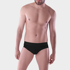 Mockup of black underpants on a guy's athletic body, men's panties for swimming, isolated on background, front view.
