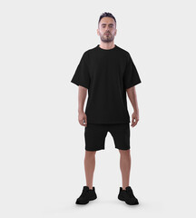 Oversized black t-shirt template, shorts on a posing guy in sports sneakers, for design, pattern, advertising in an online store.