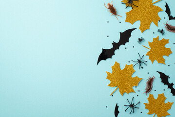 Halloween decor concept. Top view photo of gold sparkle maple leaves bat silhouettes creepy insects...