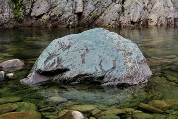 Fototapeta premium Gorgeous blue rock seen in Upper Salmon River, Fundy National Park, New Brunswick, Canada. Stunning and calm nature background. Concept for serene wilderness