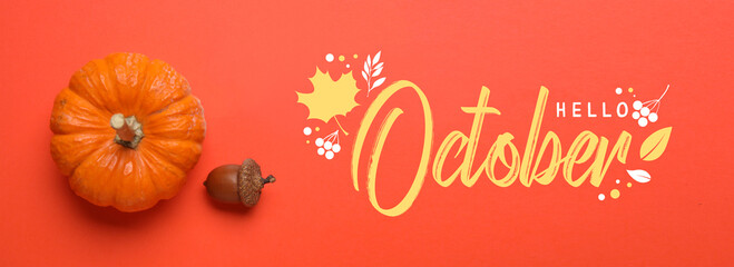 Text HELLO OCTOBER with pumpkin and acorn on red background - obrazy, fototapety, plakaty