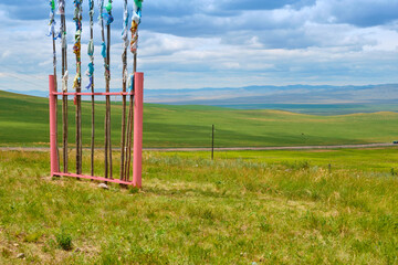 Fototapeta na wymiar Buddhist flags on a hill near the city of Ulan-Ude, Buryat Republic of Russia.