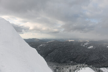 amazing view of the mountain slope covered with white snow and landscape in the background