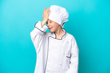 Little chef boy isolated on blue background has realized something and intending the solution