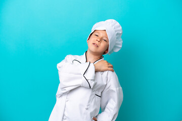 Little chef boy isolated on blue background suffering from pain in shoulder for having made an effort