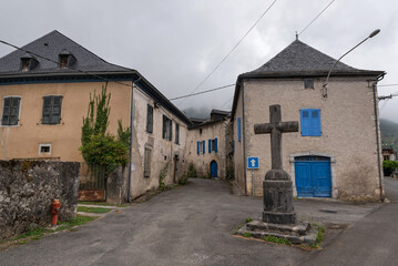 Fototapeta na wymiar Houses and cross in Bielle. Atlantic Pyrenees