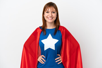 Redhead girl isolated on white background in superhero costume posing with arms at hip and smiling © luismolinero