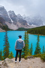  Lake moraine during a cold snowy day in Autumn in Canada, Beautiful turquoise waters of the...
