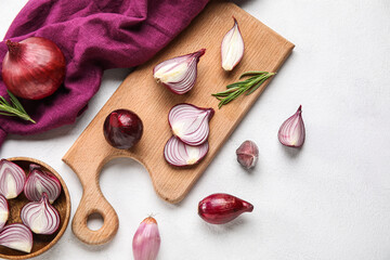Composition with red onion on light background