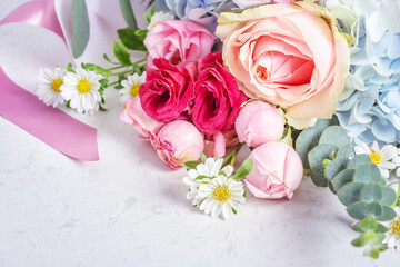 Bunch of flowers with roses and hydrangea on marble table