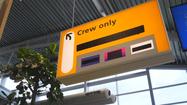 Crew only sign at airport during crowded peak season