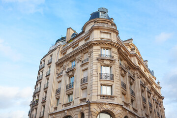 Residential building in Paris . Typical French Architecture . House with ornaments and balcony 