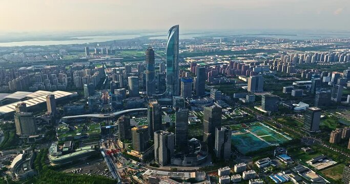 Aerial footage of city skyline and modern commercial buildings in Suzhou, China.
